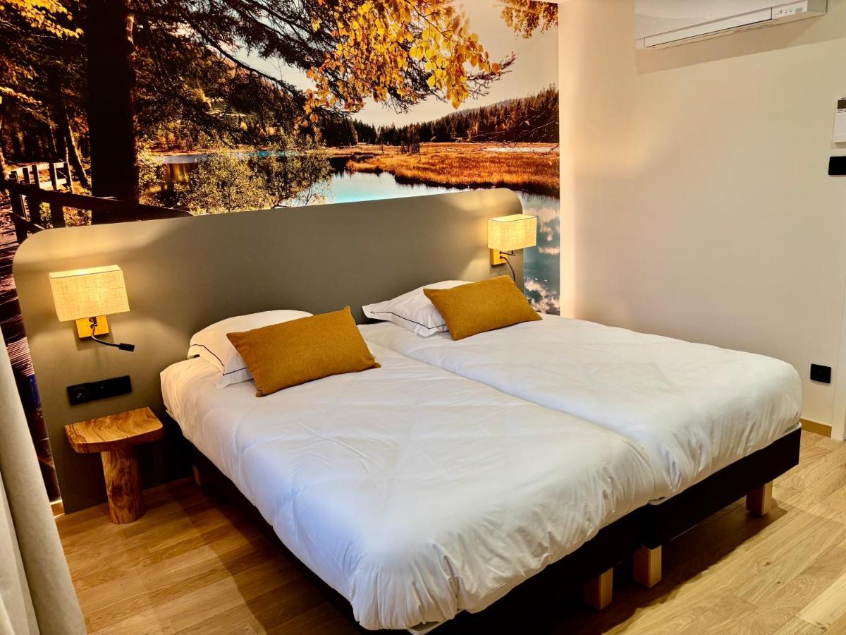 Un ou plusieurs lits dans un hébergement de l'établissement Hotel de la Jamagne & Spa