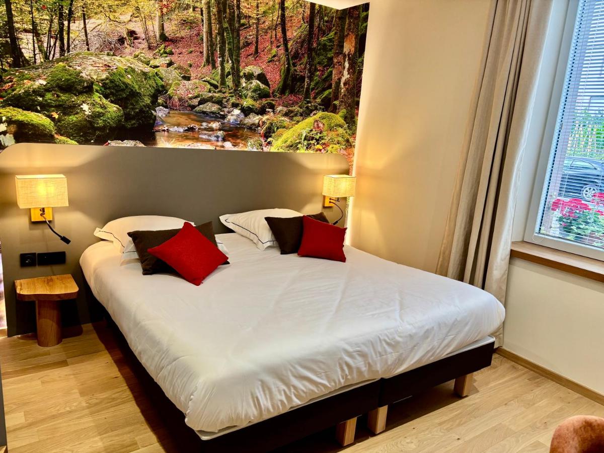 Un ou plusieurs lits dans un hébergement de l'établissement Hotel de la Jamagne & Spa