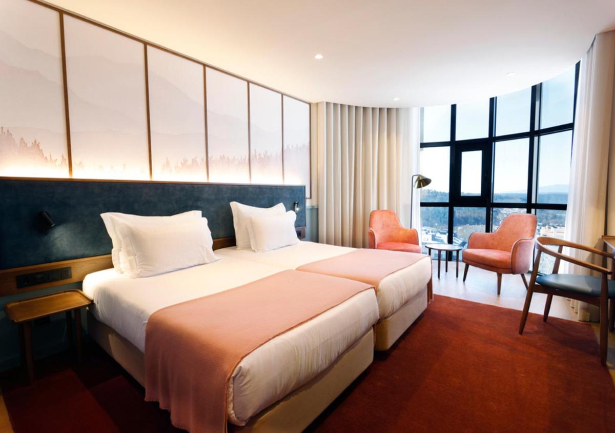 Uma cama ou camas num quarto em Montebelo Viseu Congress Hotel & Spa