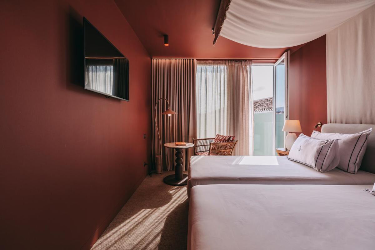 Uma cama ou camas num quarto em Torel Terra Brava