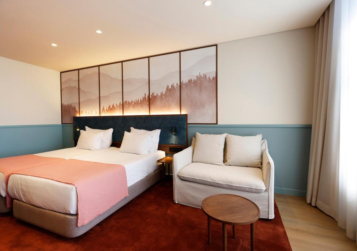 Uma cama ou camas num quarto em Montebelo Viseu Congress Hotel & Spa