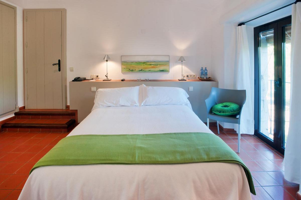 Cama o camas de una habitación en Mas Falgarona Hotel Boutique & SPA