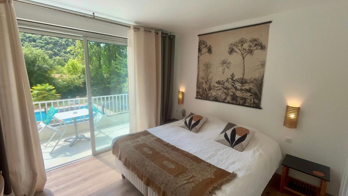 Un ou plusieurs lits dans un hébergement de l'établissement Hôtel La Ségalière Spa Bar