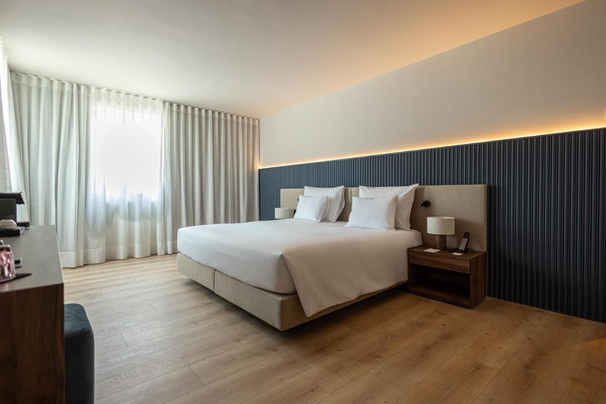 Uma cama ou camas num quarto em The Lince Braga