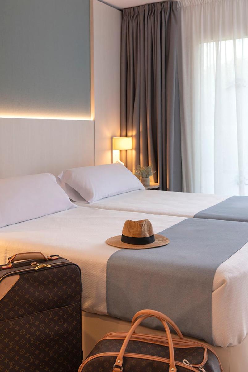 Cama o camas de una habitación en Aparthotel Costa Encantada