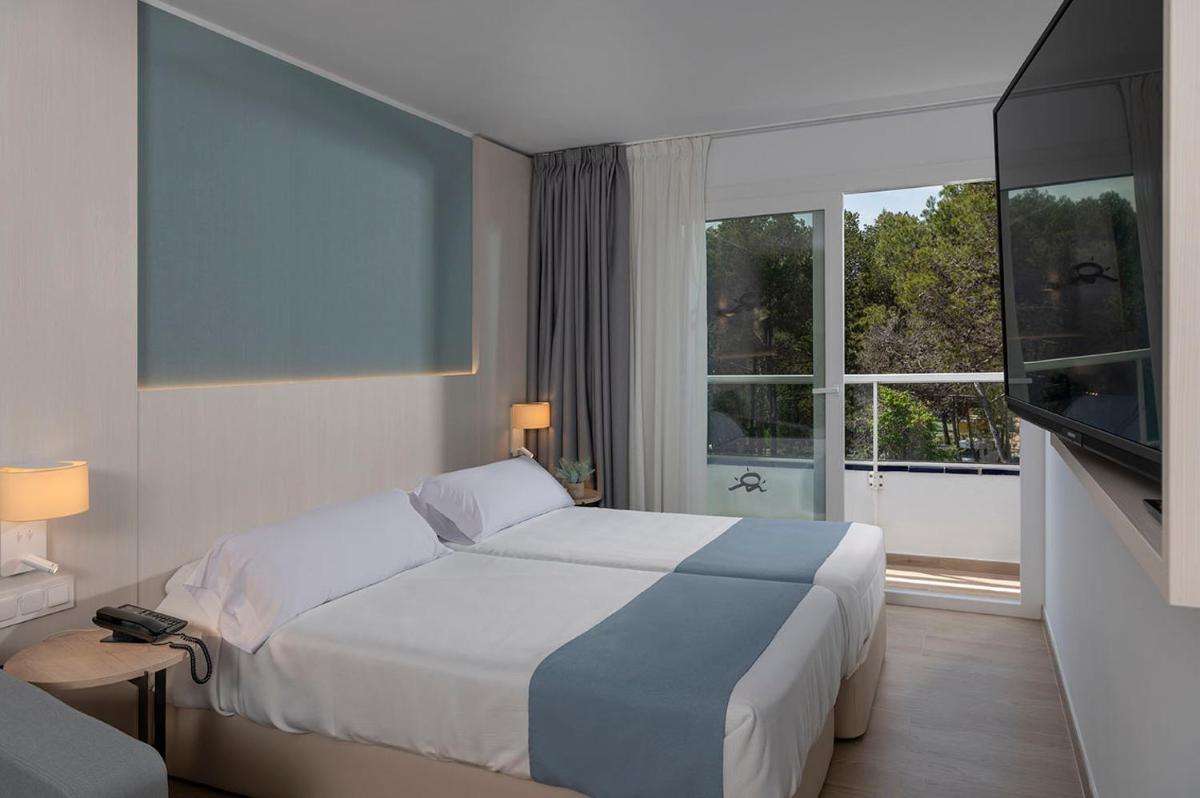 Cama o camas de una habitación en Aparthotel Costa Encantada