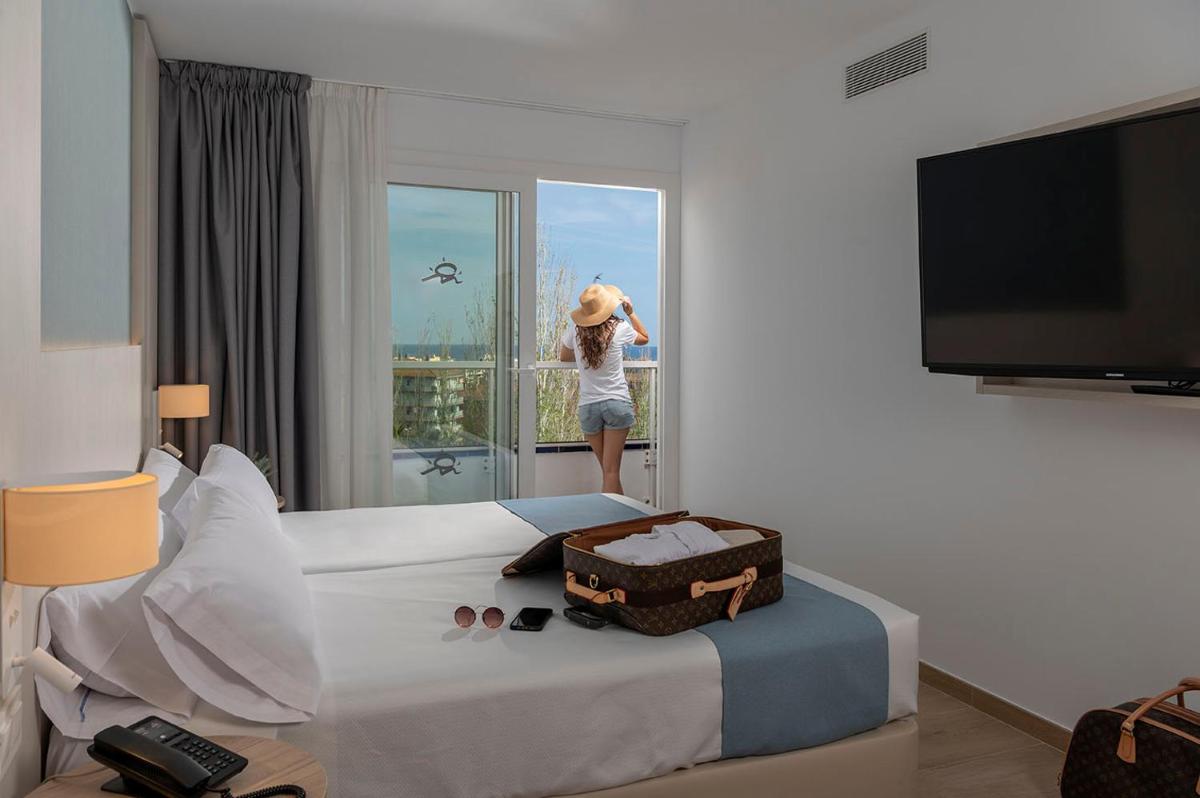 Cama o camas de una habitación en Aparthotel Costa Encantada