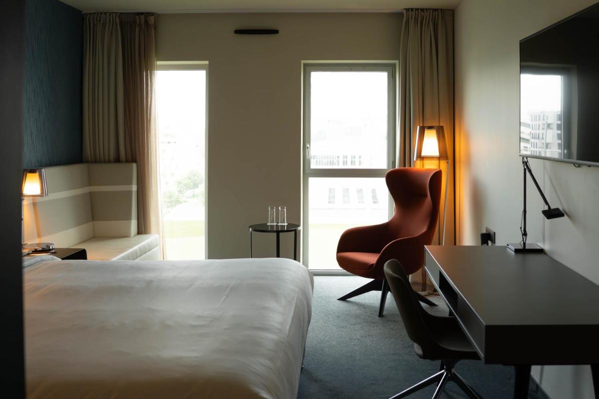 Un ou plusieurs lits dans un hébergement de l'établissement Radisson Blu Hotel Bordeaux