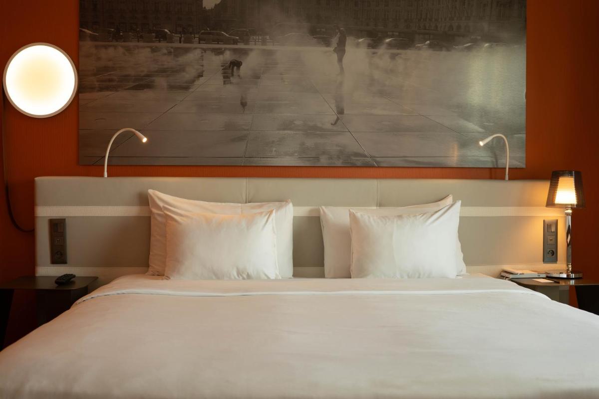 Un ou plusieurs lits dans un hébergement de l'établissement Radisson Blu Hotel Bordeaux