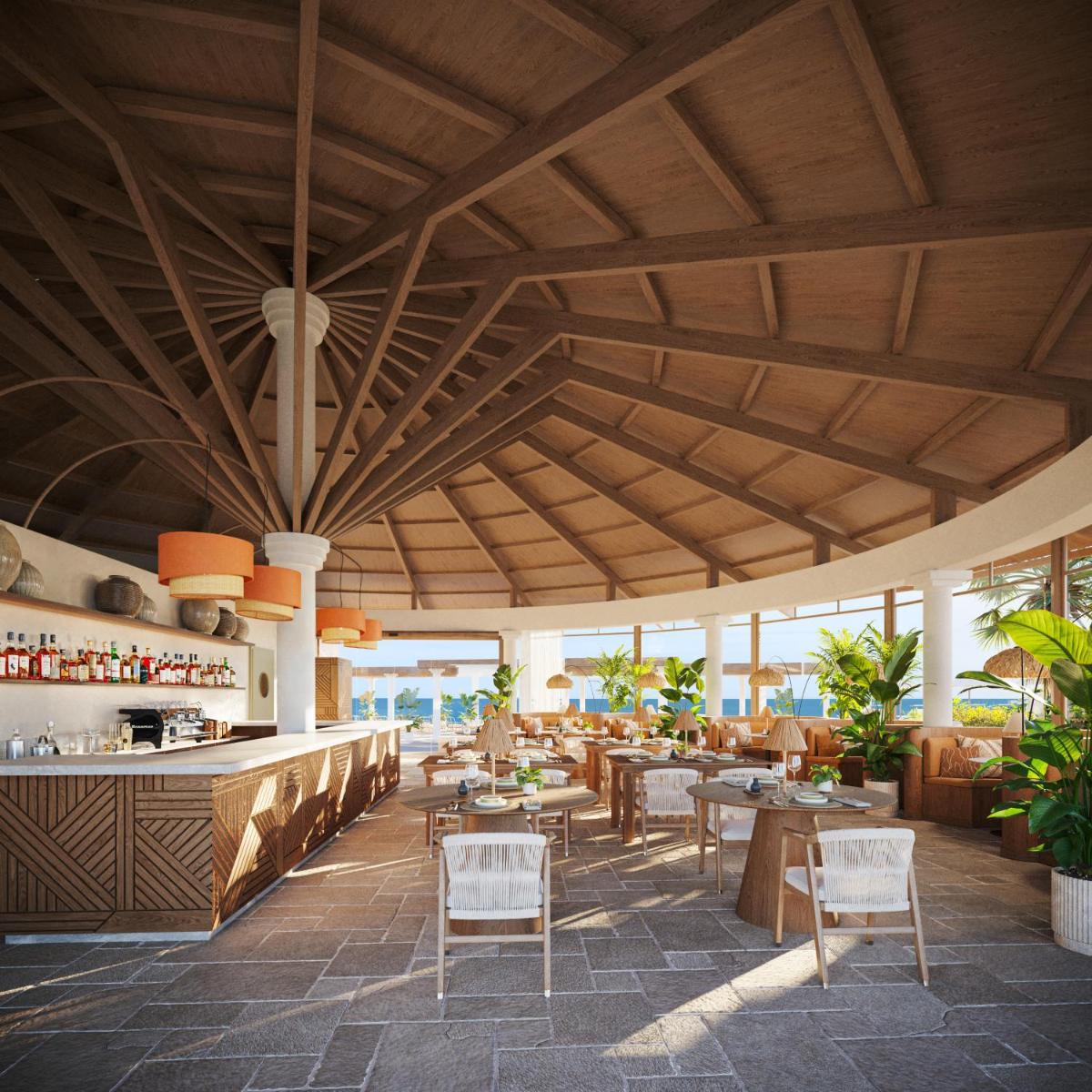 Un restaurante con techos de madera y mesas y sillas. en Iberostar Selection Fuerteventura Palace, en Morro del Jable