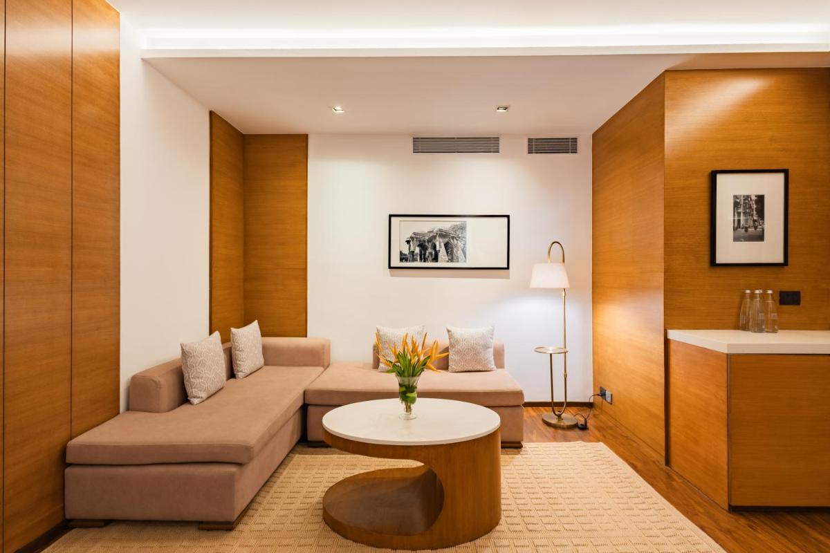 a living room with a couch and a table at Hyatt Pune in Pune