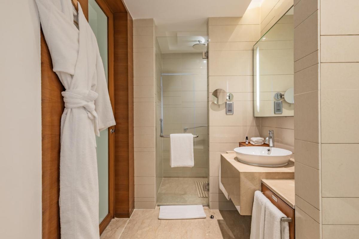a bathroom with a sink and a shower at Hyatt Pune in Pune