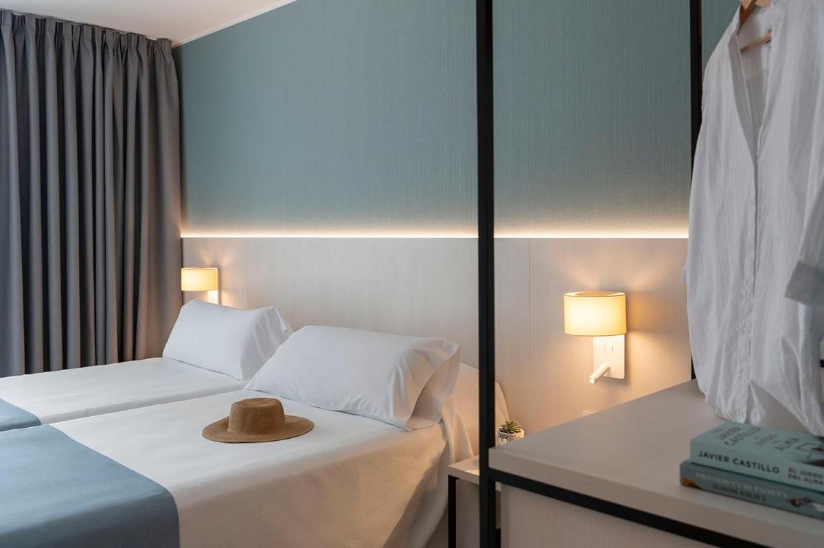 Cama o camas de una habitación en Aparthotel Costa Encantada