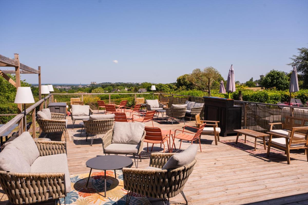 Coin salon dans l'établissement Les Terrasses de Saumur - Hôtel & Appartements - Restaurant & Spa (Logis)
