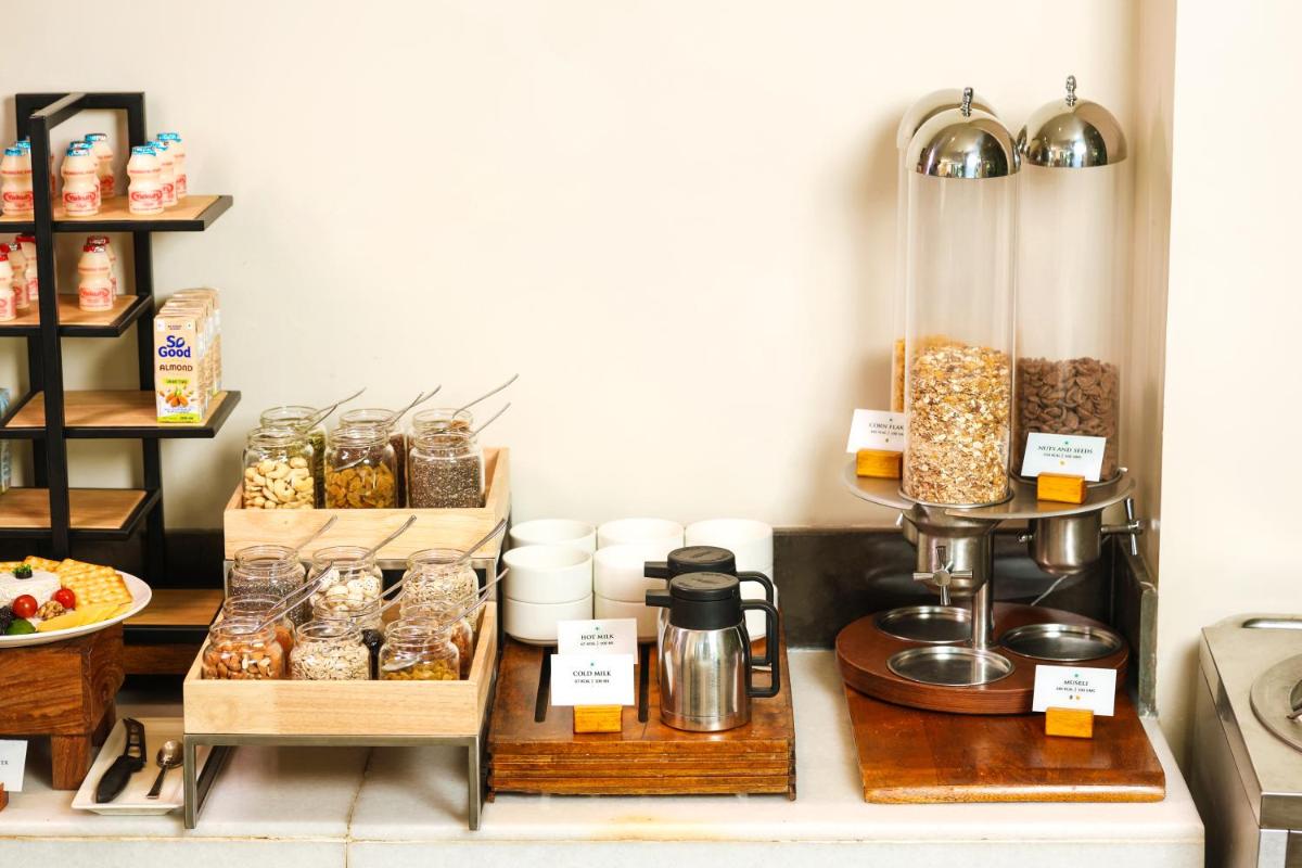 a bakery with a display of food and other items at Anand Kashi by the Ganges Rishikesh - IHCL Seleqtions in Rishīkesh