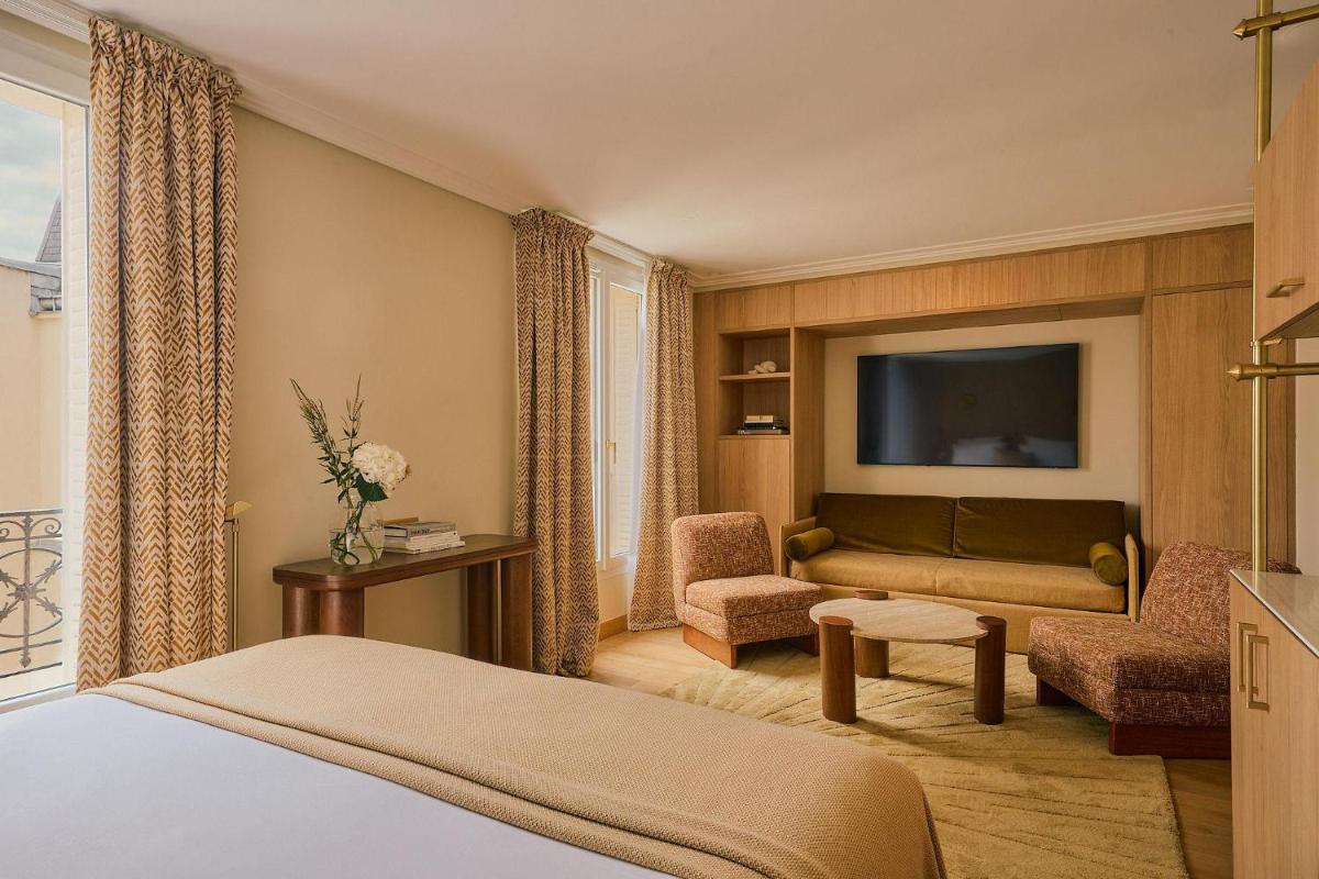 Télévision ou salle de divertissement dans l'établissement Hôtel Madison