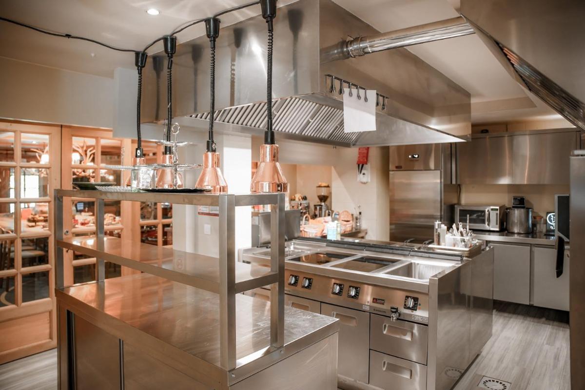 Cuisine ou kitchenette dans l'établissement Magic Megève Bois