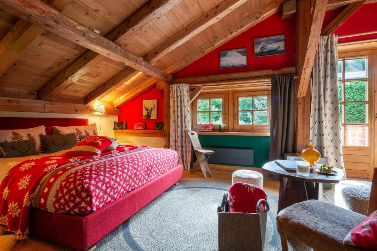 Un ou plusieurs lits dans un hébergement de l'établissement Magic Megève Bois
