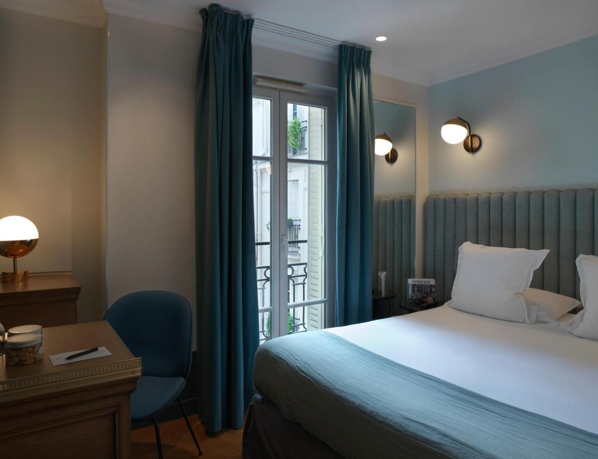 Un ou plusieurs lits dans un hébergement de l'établissement Hotel Bachaumont