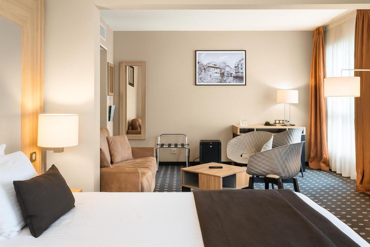 Un ou plusieurs lits dans un hébergement de l'établissement 7Hotel&Spa