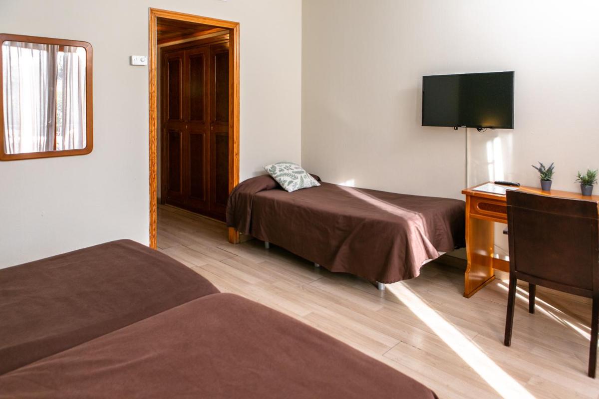 Cama o camas de una habitación en Hotel Snö Condes del Pallars
