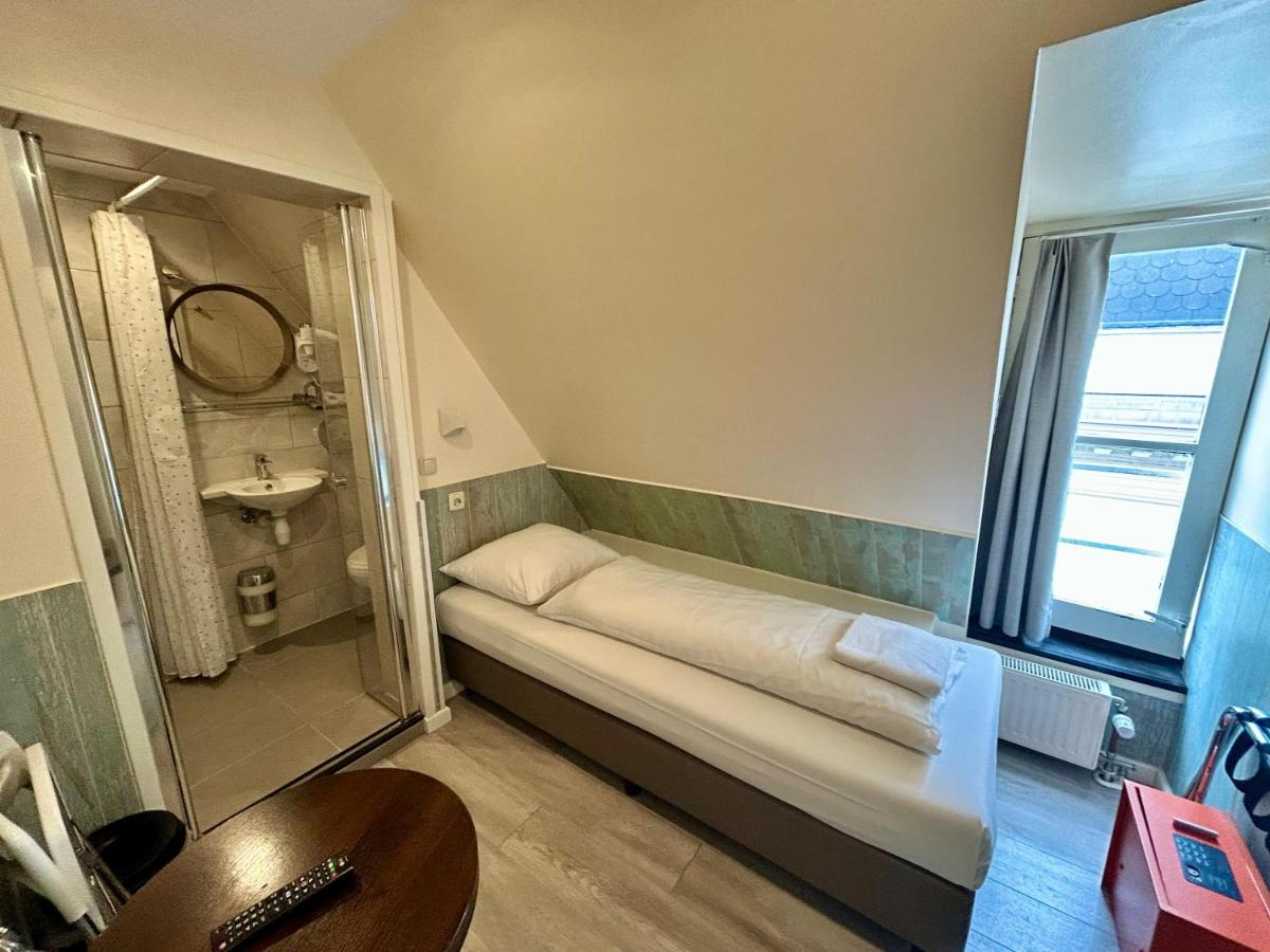Hotel Damrak Inn - Housity