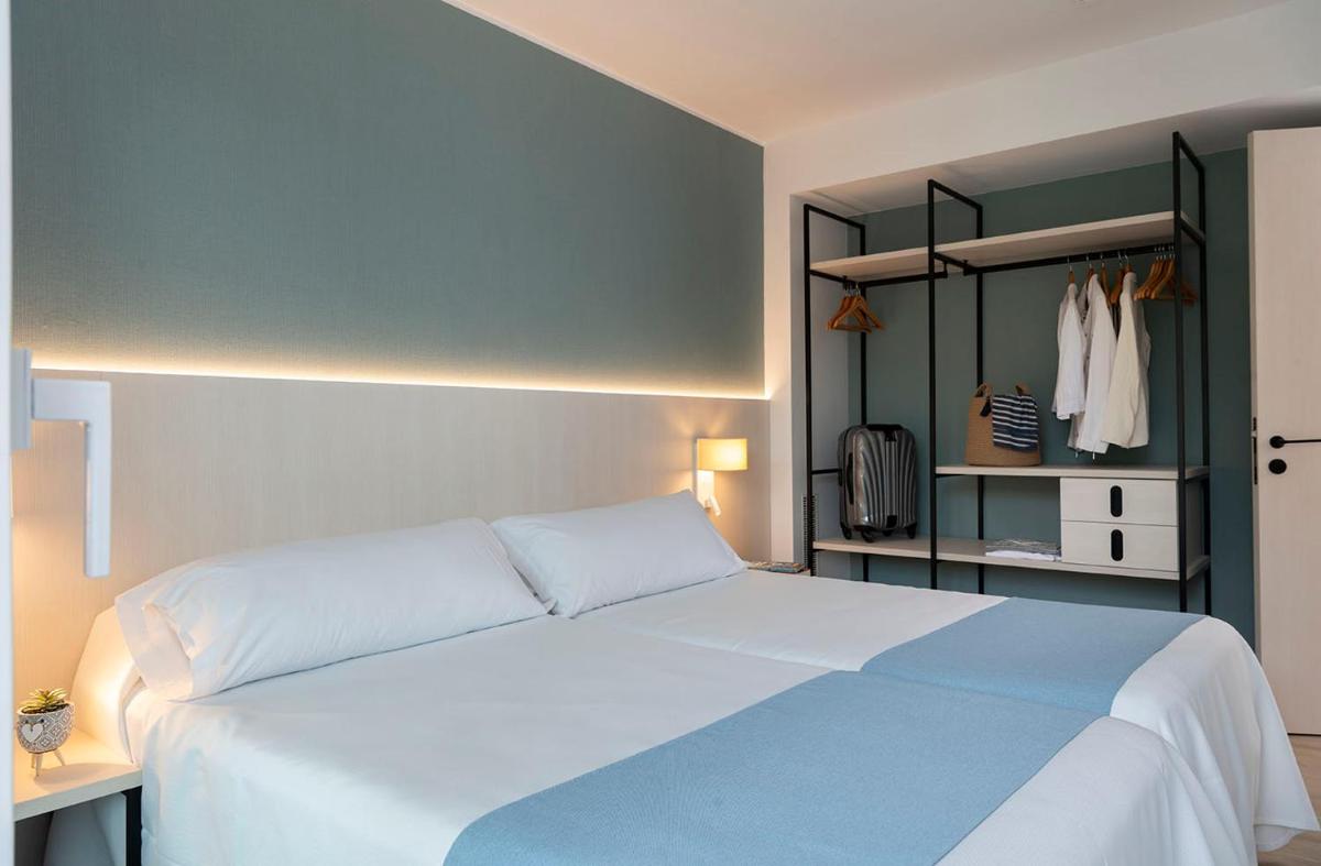 Cama o camas de una habitación en Aparthotel Costa Encantada