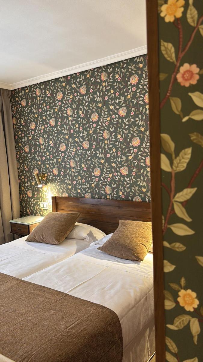Cama o camas de una habitación en Hotel Rural Spa & Wellness Hacienda Los Robles