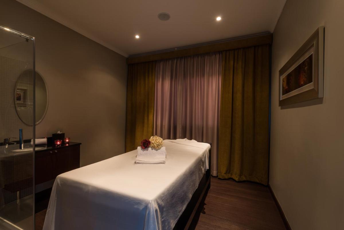 Uma cama ou camas num quarto em Vila Gale Porto - Centro