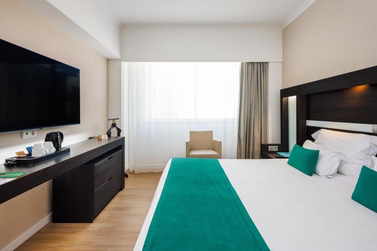 Uma cama ou camas num quarto em Jupiter Algarve Hotel - Beach & Spa