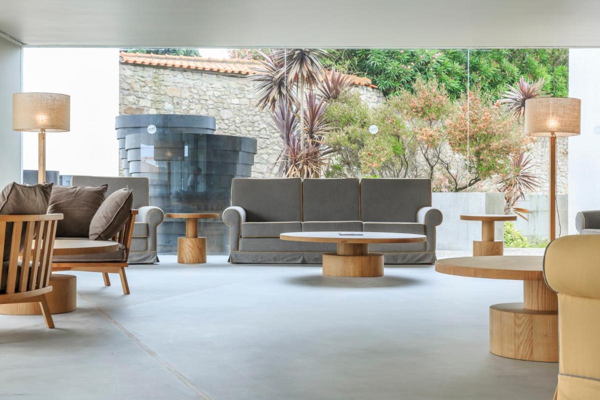 Uma área de estar em Villa C Boutique Hotel