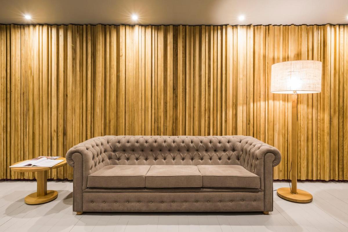 Uma área de estar em Villa C Boutique Hotel