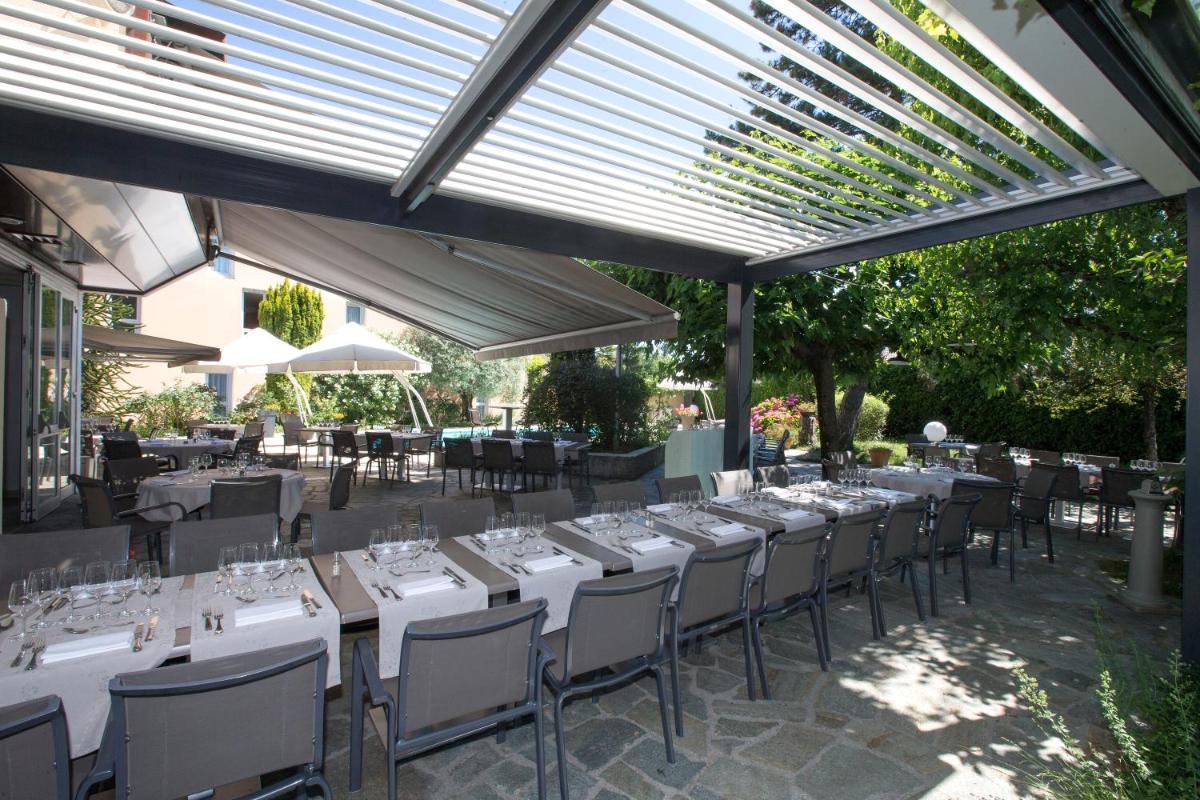Restaurant ou autre lieu de restauration dans l'établissement PoMo Hôtel & Restaurant