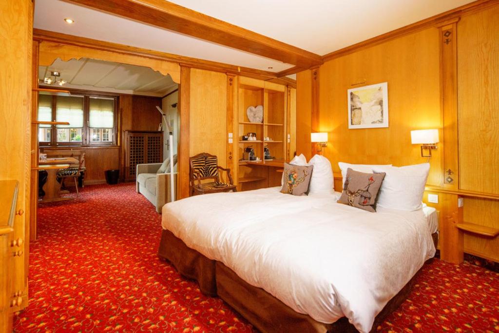 Un ou plusieurs lits dans un hébergement de l'établissement Hotel - Restaurant Le Cerf & Spa