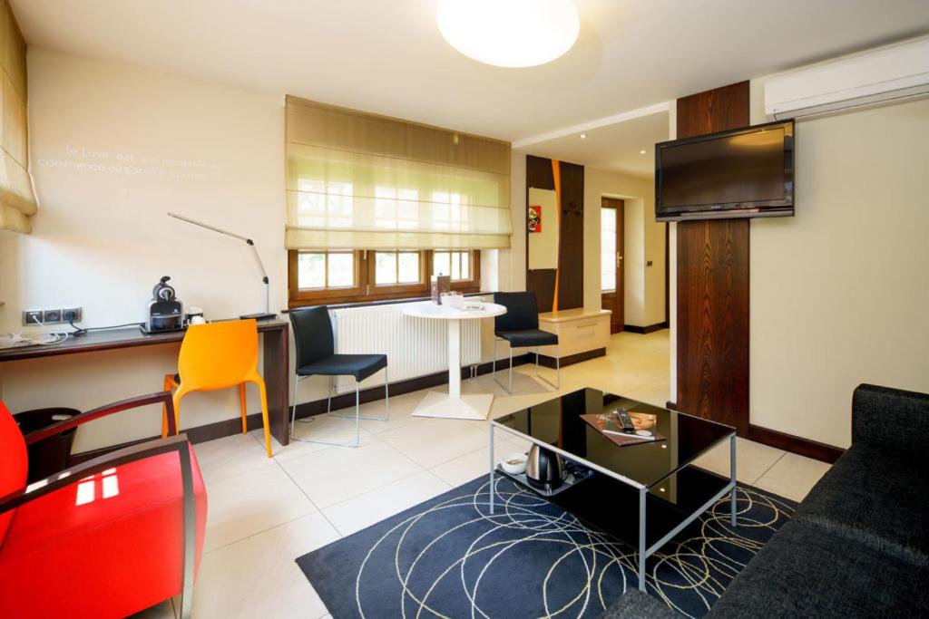 Coin salon dans l'établissement Hotel - Restaurant Le Cerf & Spa