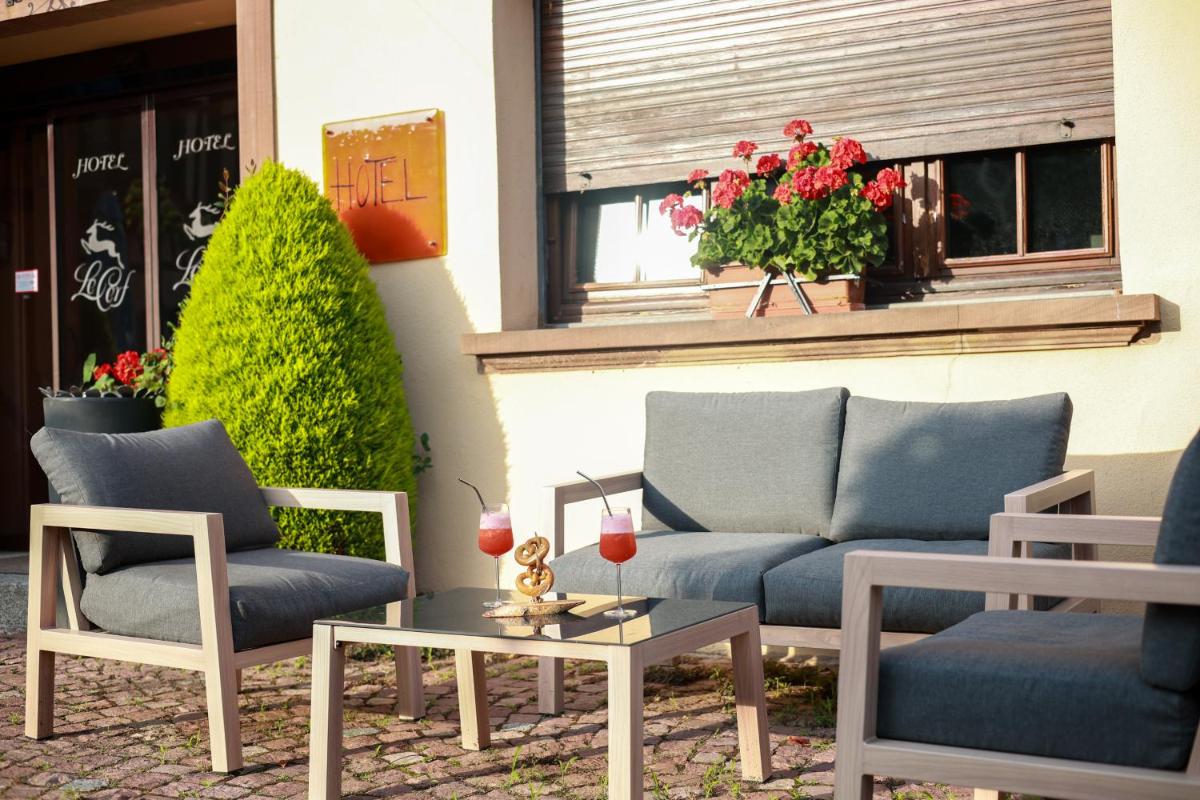 Coin salon dans l'établissement Hotel - Restaurant Le Cerf & Spa