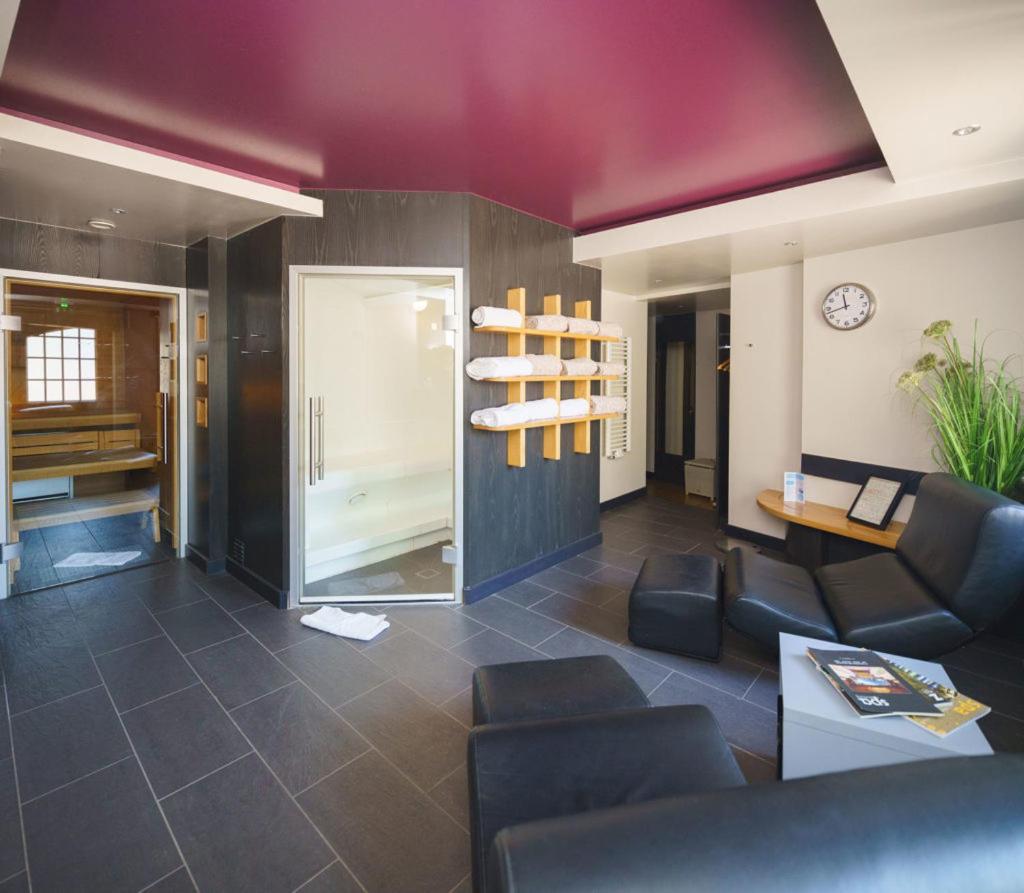 Coin salon dans l'établissement Hotel - Restaurant Le Cerf & Spa
