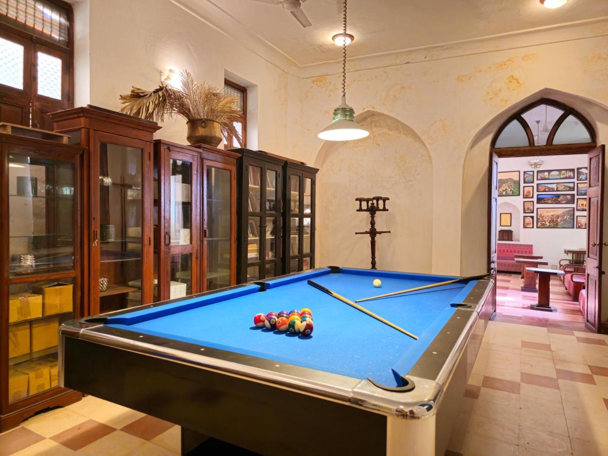 a billiard room with a blue pool table at Neemrana Fort-Palace in Neemrana