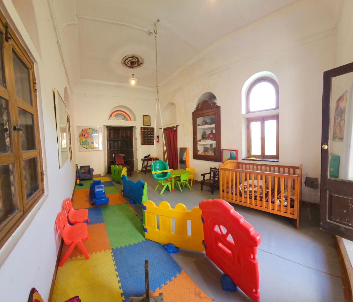 a room with a play room with toys on the floor at Neemrana Fort-Palace in Neemrana