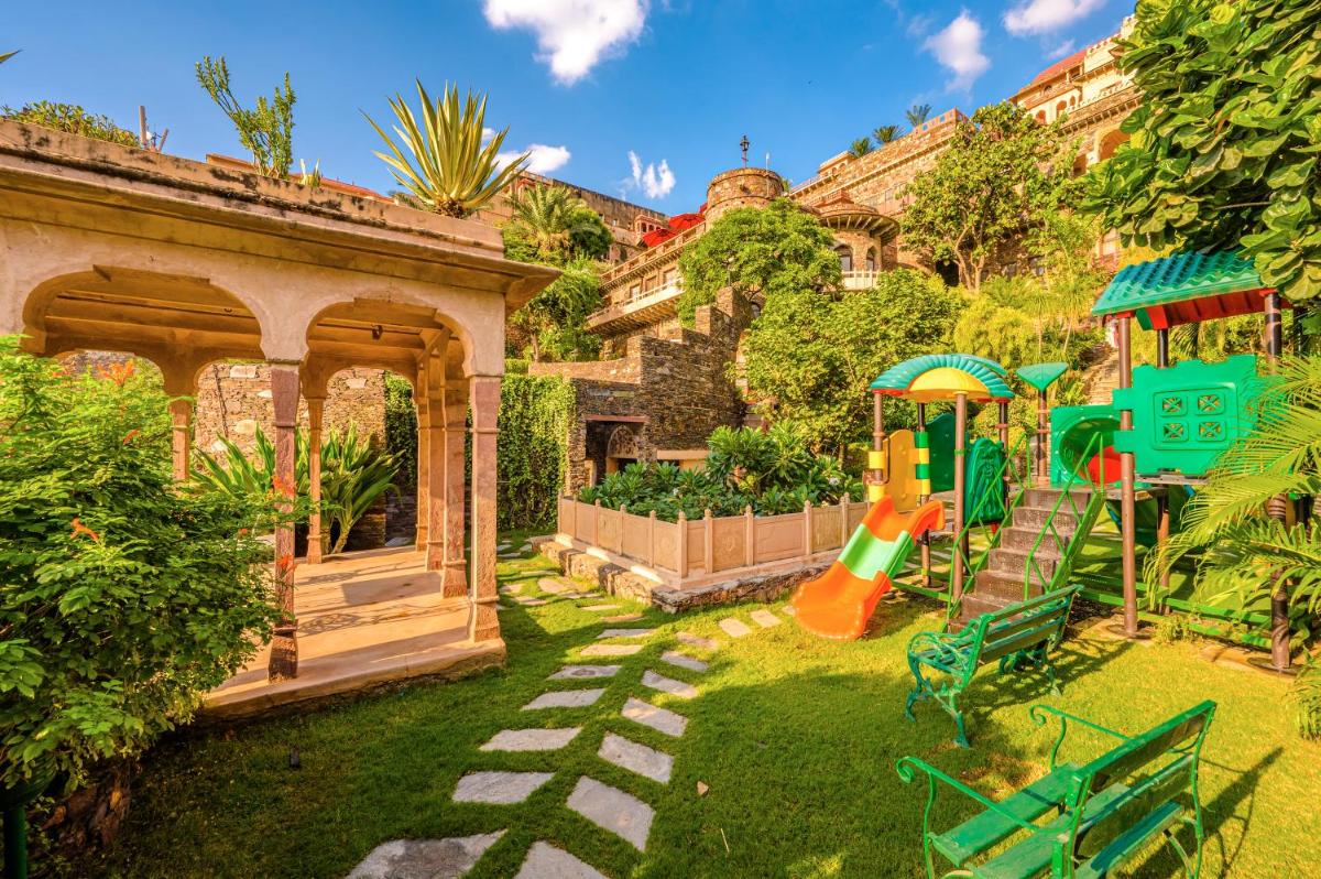 a backyard with a playground and a play structure at Neemrana Fort-Palace in Neemrana