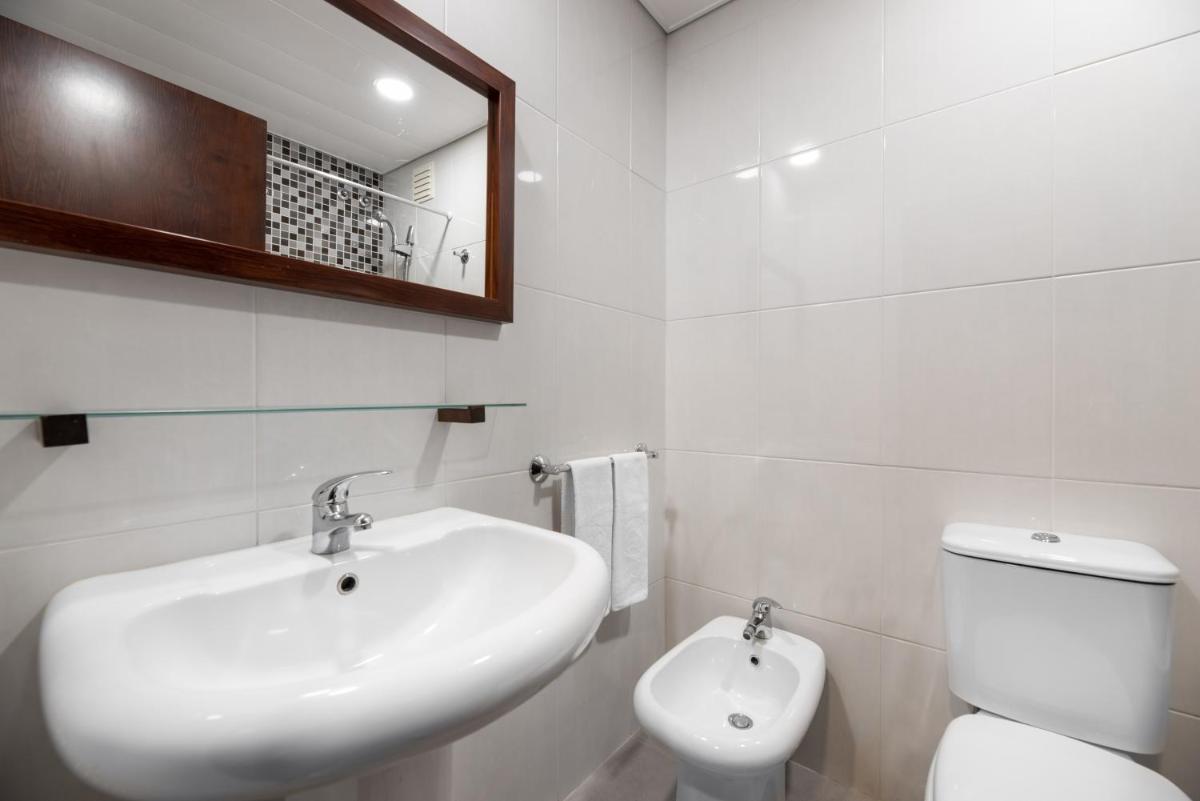 Uma casa de banho em Dorma Praia Golfe