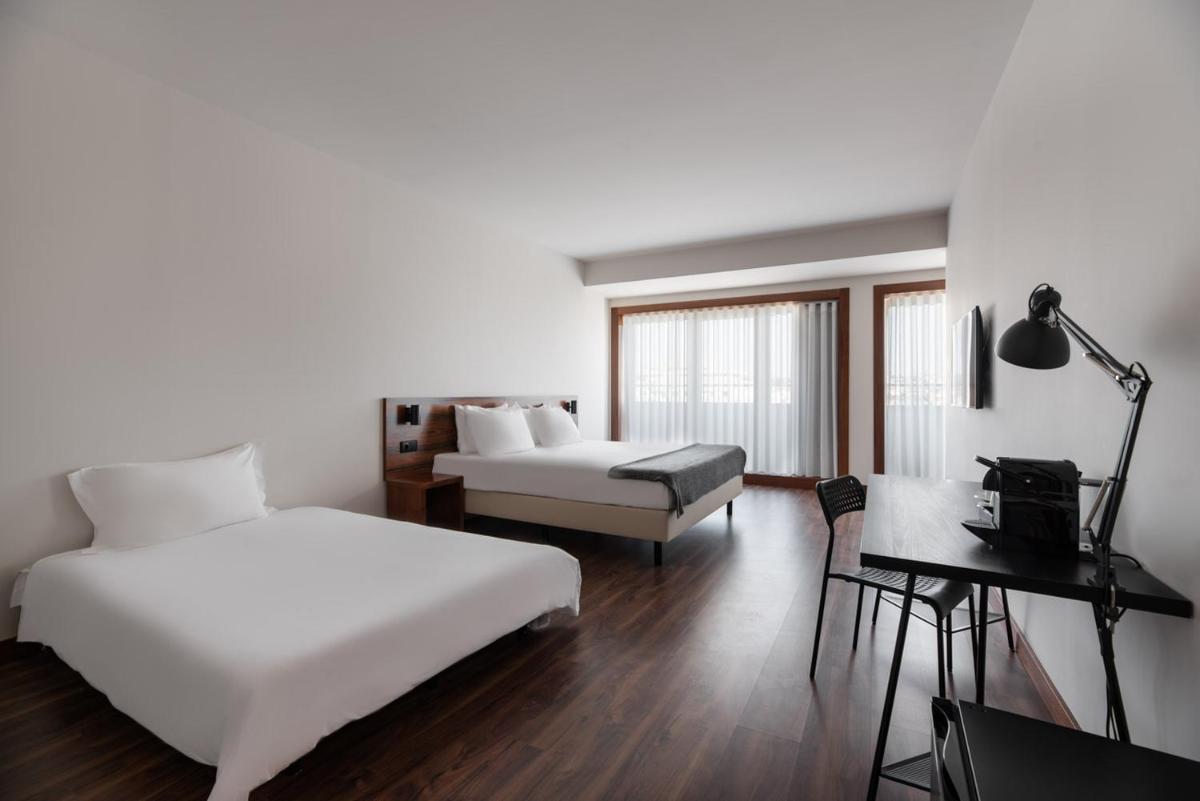 Uma cama ou camas num quarto em Dorma Praia Golfe