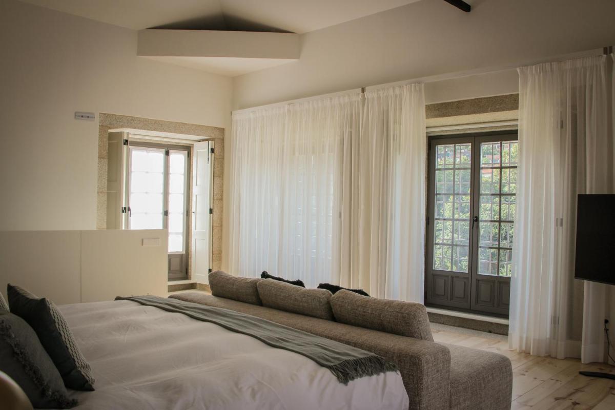 Uma cama ou camas num quarto em MS Collection Arouca - Mosteiro de Arouca