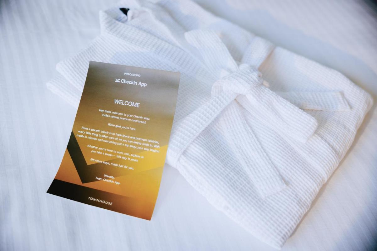 a white shirt with a welcome sign on it at Sunday Hotel Chandigarh Zirakpur in Zirakpur