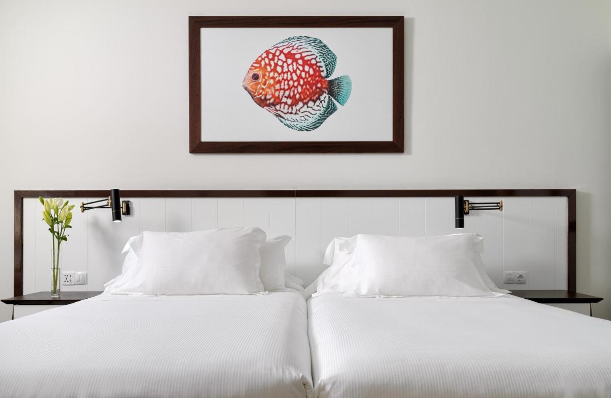 Cama o camas de una habitación en H10 Playa Esmeralda - Adults Only