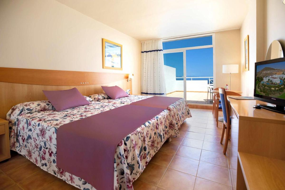 Cama o camas de una habitación en Hotel Servigroup Marina Mar