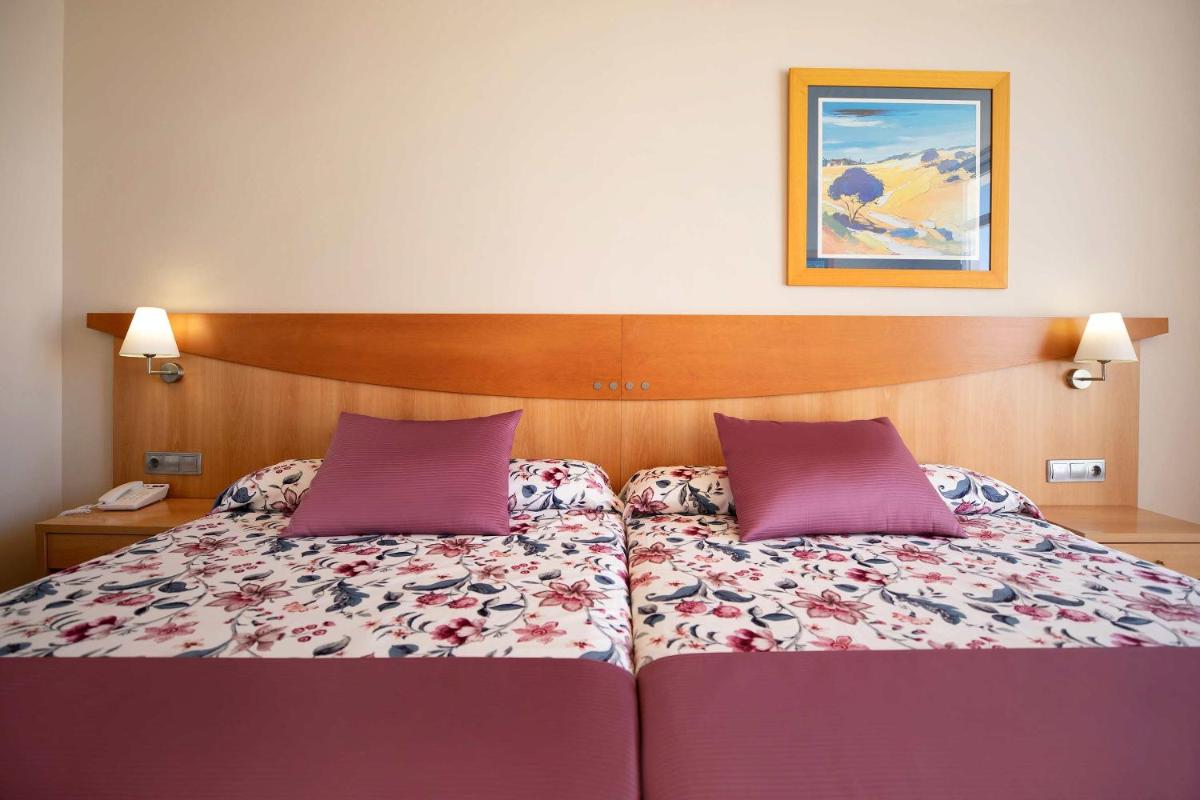Cama o camas de una habitación en Hotel Servigroup Marina Mar