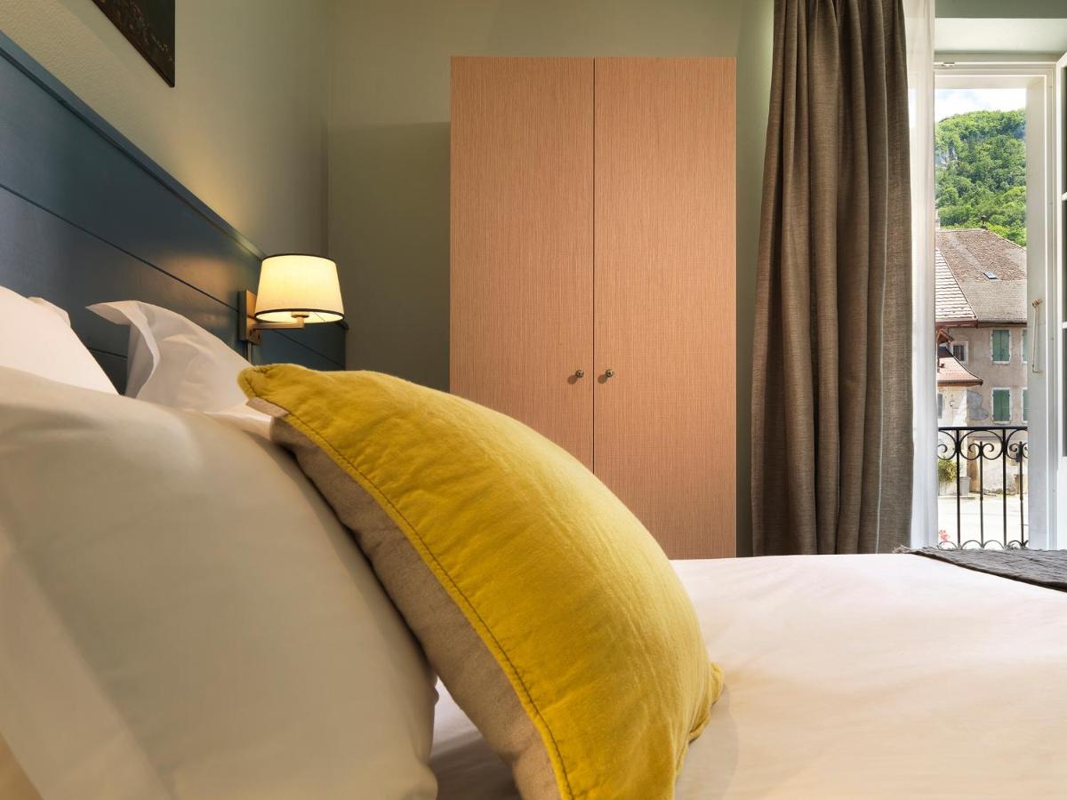 Un ou plusieurs lits dans un hébergement de l'établissement Hôtel Beau Site Talloires B SPA