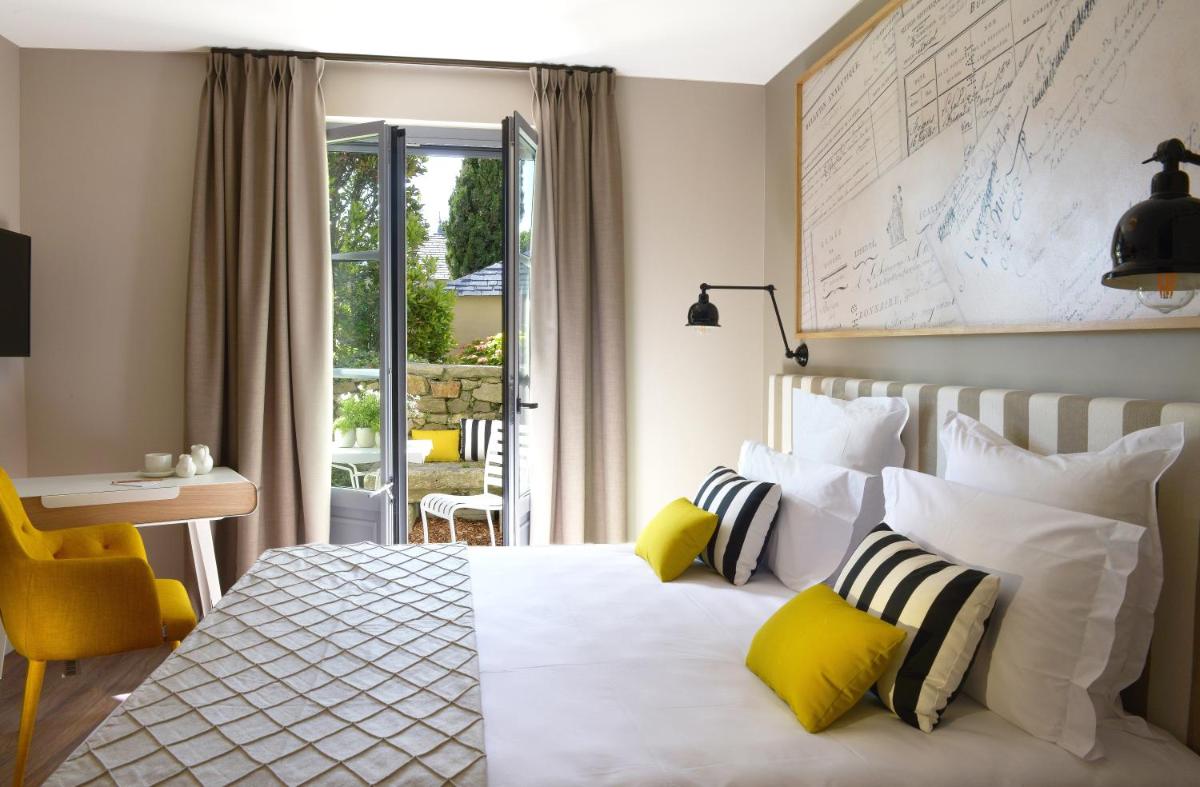 Un ou plusieurs lits dans un hébergement de l'établissement Le Général d'Elbée Hotel & Spa - Teritoria