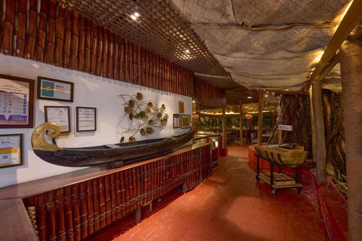 a room with a large boat on the wall at Casino Hotel - CGH Earth, Cochin in Cochin